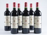six bottles of red wine are lined up in a row