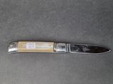 a knife that is laying on a table