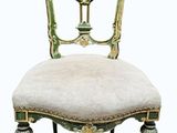 an image of a green and gold chair with a white seat