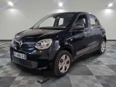 a picture of a small black car parked in a garage