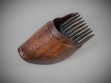 a wooden comb that is sitting on a table