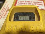 a close up of a yellow fire hydrant with a clock on it