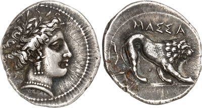 a silver coin with an image of a woman and a lion on it