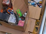 a cardboard box filled with assorted items on the floor
