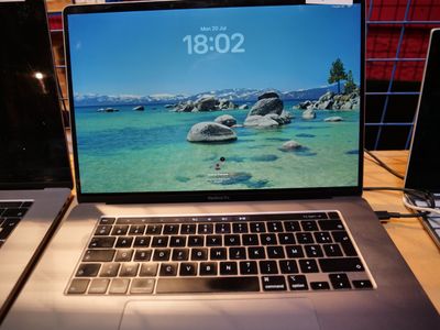 two laptops that are sitting on a table