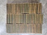 a pile of old books stacked on top of each other