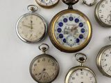 many different types of pocket watches arranged in a circle