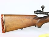 an image of a rifle with a wooden barrel on a white background