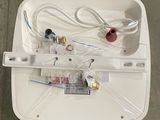 a white box with wires and wires attached to it