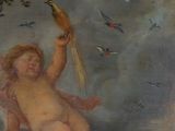a painting of a cupid holding a bird in the air