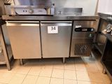a stainless steel counter in a commercial kitchen with a lot of counter space