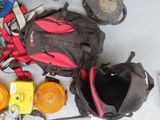 a lot of tools and a backpack on the floor