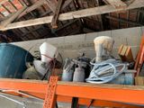 many different types of tools on a shelf in a garage
