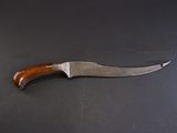 a knife that is laying on a table
