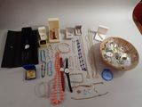 a table with a basket of jewelry on it