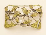 a brooch that is sitting on a table