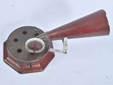 a red object that is sitting on a white surface