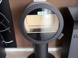 a black table with a mirror on top of it in a room