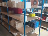 many shelves with boxes on them in a warehouse