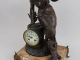 statue of a woman holding a clock on a wooden base