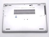 a silver laptop with a small hole in the back