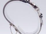 silver bracelet with a chain and a clasp on a white background