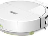 gros plan d'un aspirateur robot sur une surface blanche