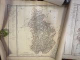 a map of ireland on a table with a cup of coffee