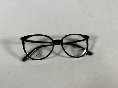 black glasses with clear lenses on a white surface