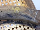 a banana sitting on top of a chair with holes in it