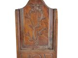 an old wooden door with a flower carved into it