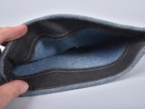 a person holding an empty wallet in their hand