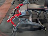 a gym room with a bench, weights, and other equipment