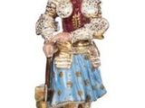 an image of a figurine of a woman with a basket