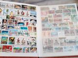 an open book with pictures of people and animals on it