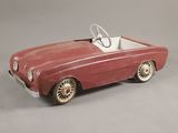 an old red toy car with a steering and a steering wheel