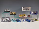 a lot of toy cars that are on display on a shelf