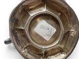 an antique silver ashtray on a white background with a price tag