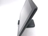a tablet that is sitting on a stand on the table