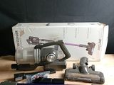 a box of vacuum cleaners and other tools on a table