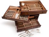 a wooden box with silverware in it on a white surface