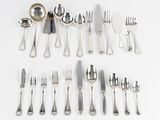 a lot of silverware on the table and silverware on the table
