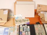 a table with a lot of stamps and other items on it