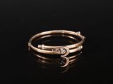 a gold ring with a snake on it