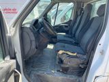 the interior of a van with the door open and the passenger seat down