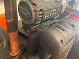 a picture of a drill and a hammer on a workbench