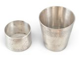 pair of silver cups on a white background