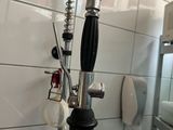 a faucet that is attached to a sink in a bathroom