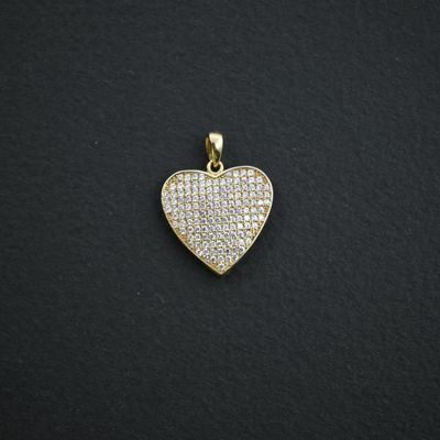 a gold heart pendant with white diamonds on a black background