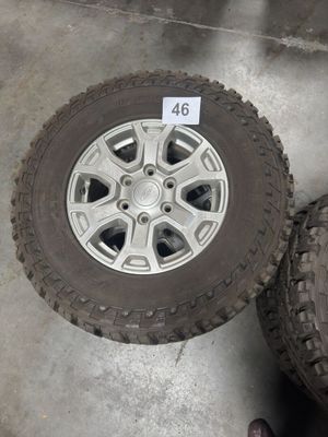 two tires that are sitting next to each other on the floor